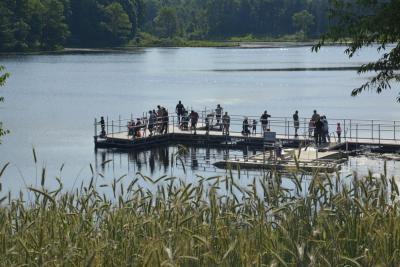 Group of kids and officers on fishing pier at Trail Lake Park 