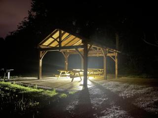 Dix Park pavilion backlit at night 