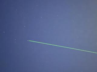 laser pointing at stars