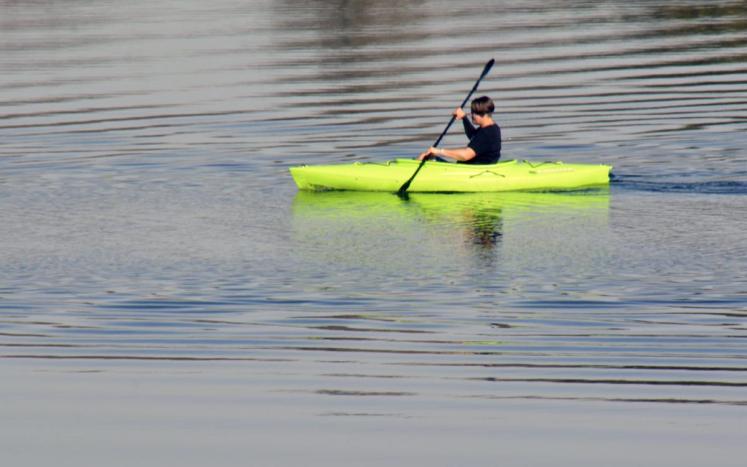 person in kayak on the water